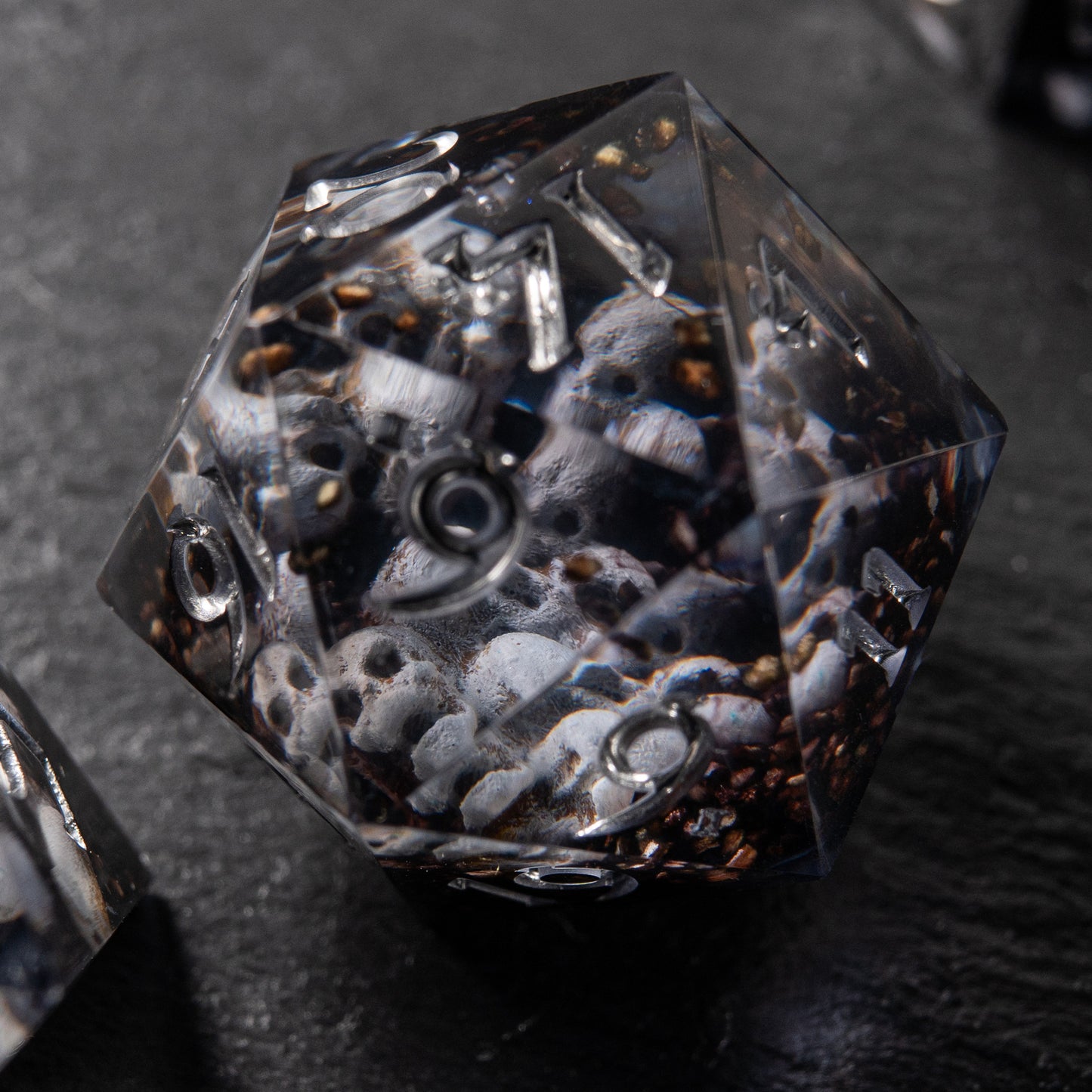 Polyhedral skull dice set – Prison of Souls handmade resin dice for RPG players.