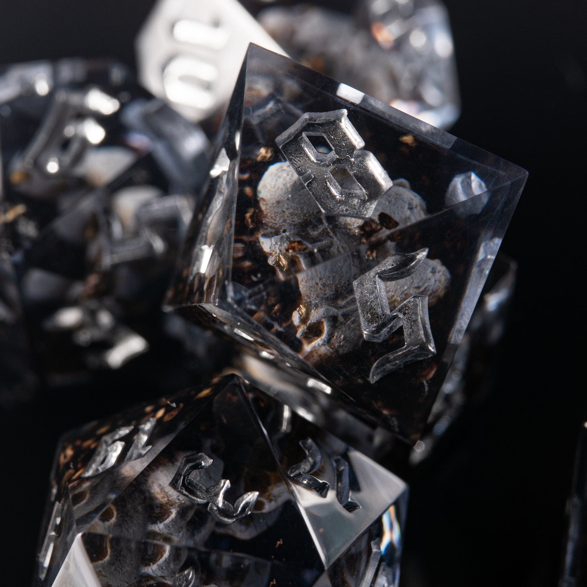 D&D dice set “Prison of Souls” – handmade resin dice with staring eyes and spectral figures.