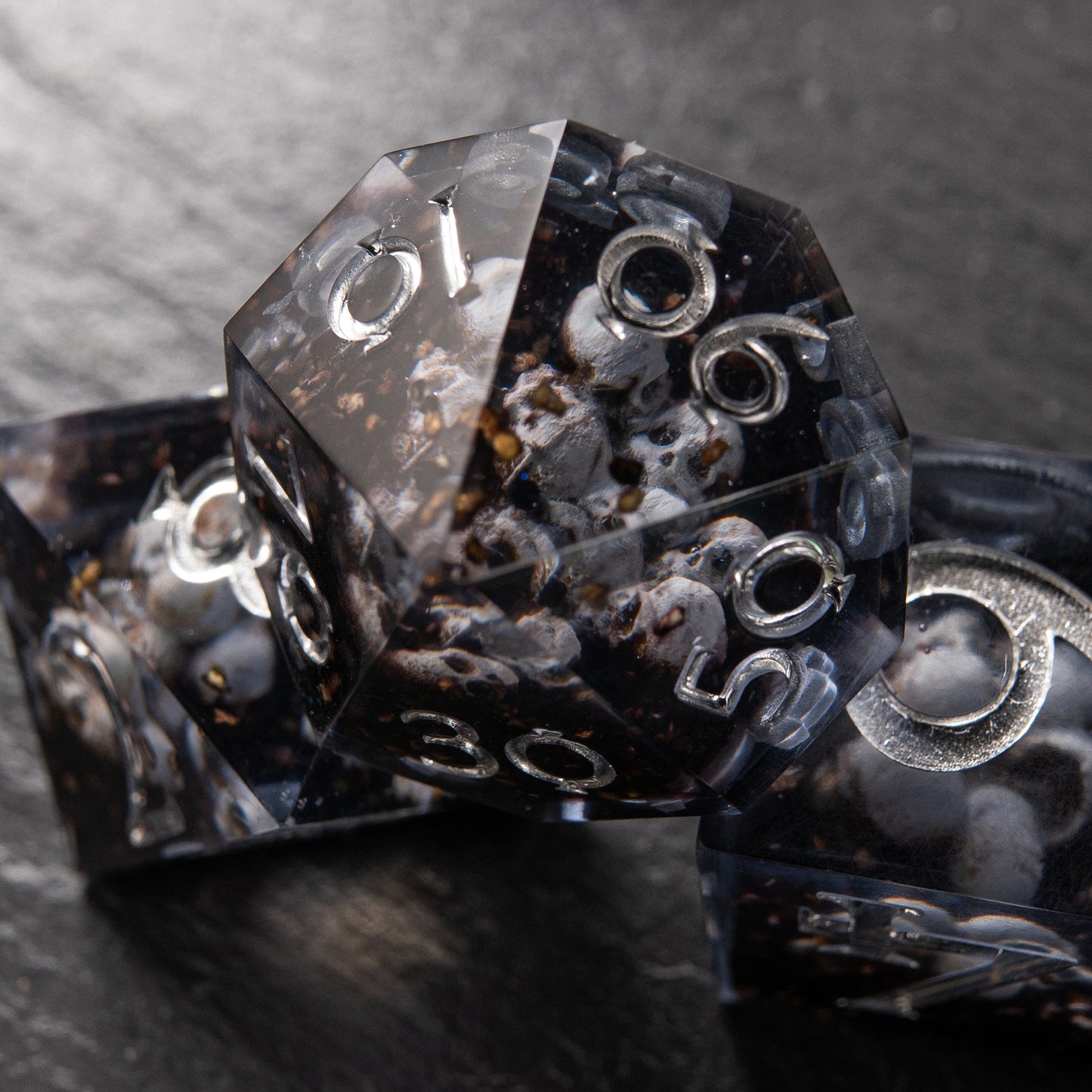 Eerie skull-filled D&D dice – Prison of Souls resin dice set for collectors.