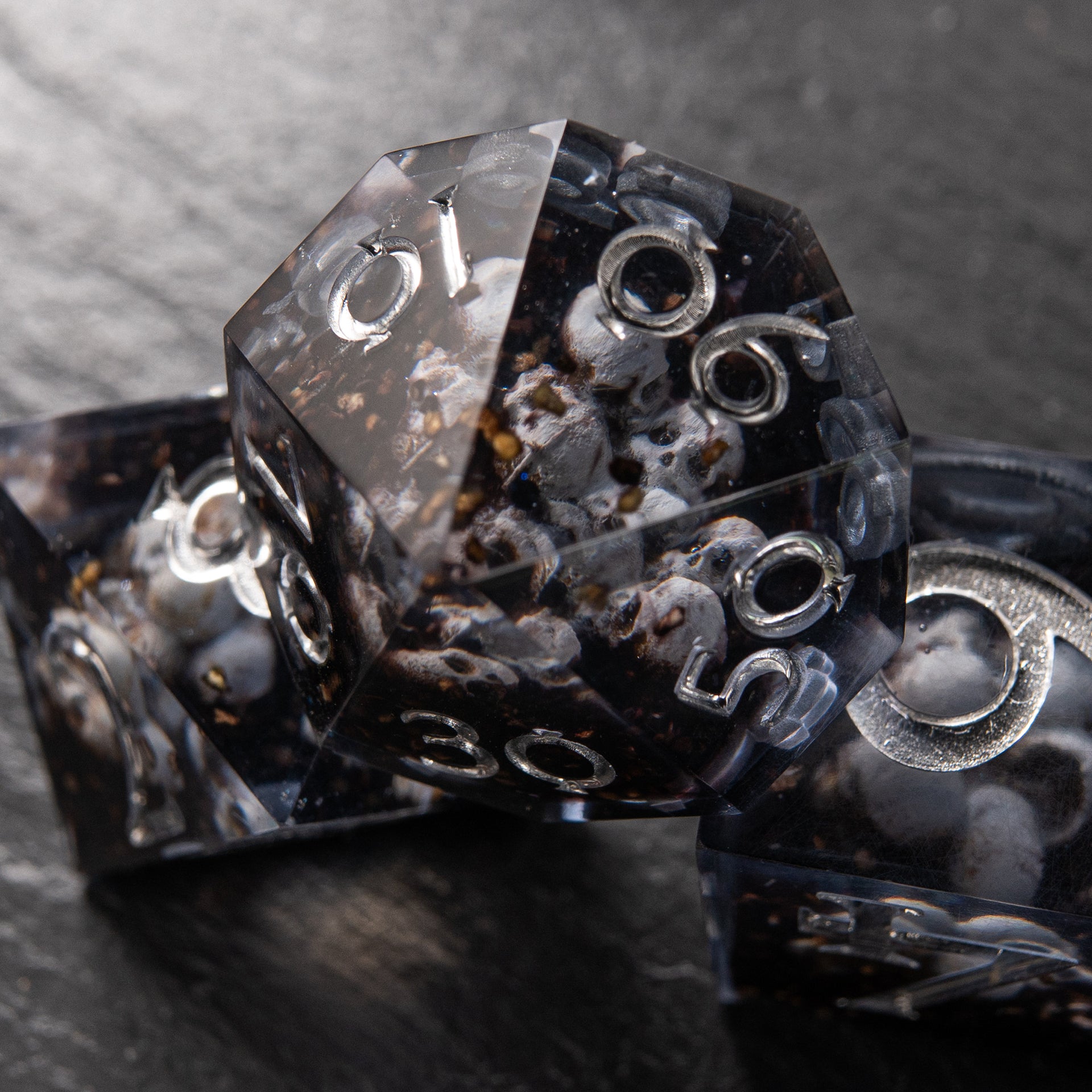 Eerie skull-filled D&D dice – Prison of Souls resin dice set for collectors.