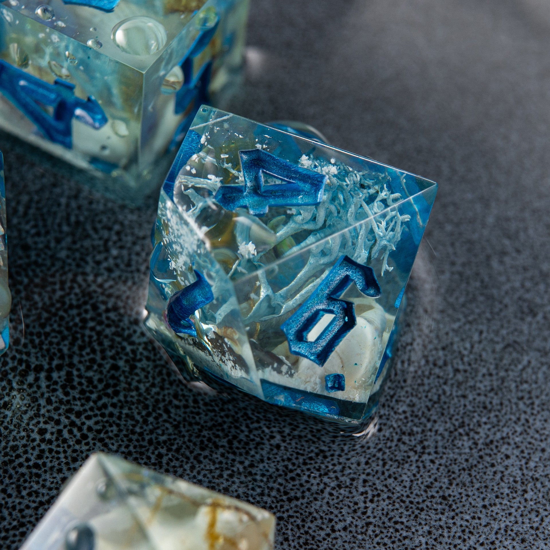 Handmade ocean-themed resin dice set – artisan polyhedral dice with mini crabs and coral for D&D and tabletop RPGs.