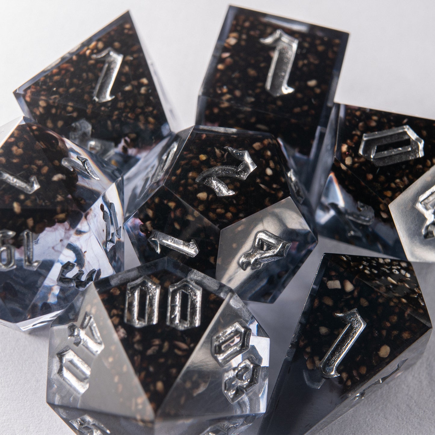Handmade resin dice set with imprisoned souls inside – perfect for D&D and dark fantasy TTRPG campaigns.