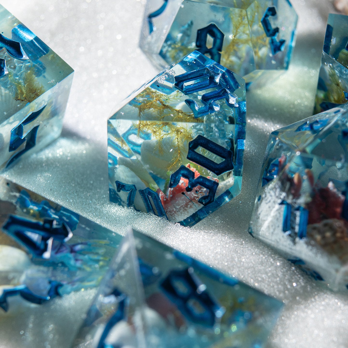 Polyhedral dice set inspired by ocean magic – handmade resin dice with sea life details for Dungeons & Dragons.