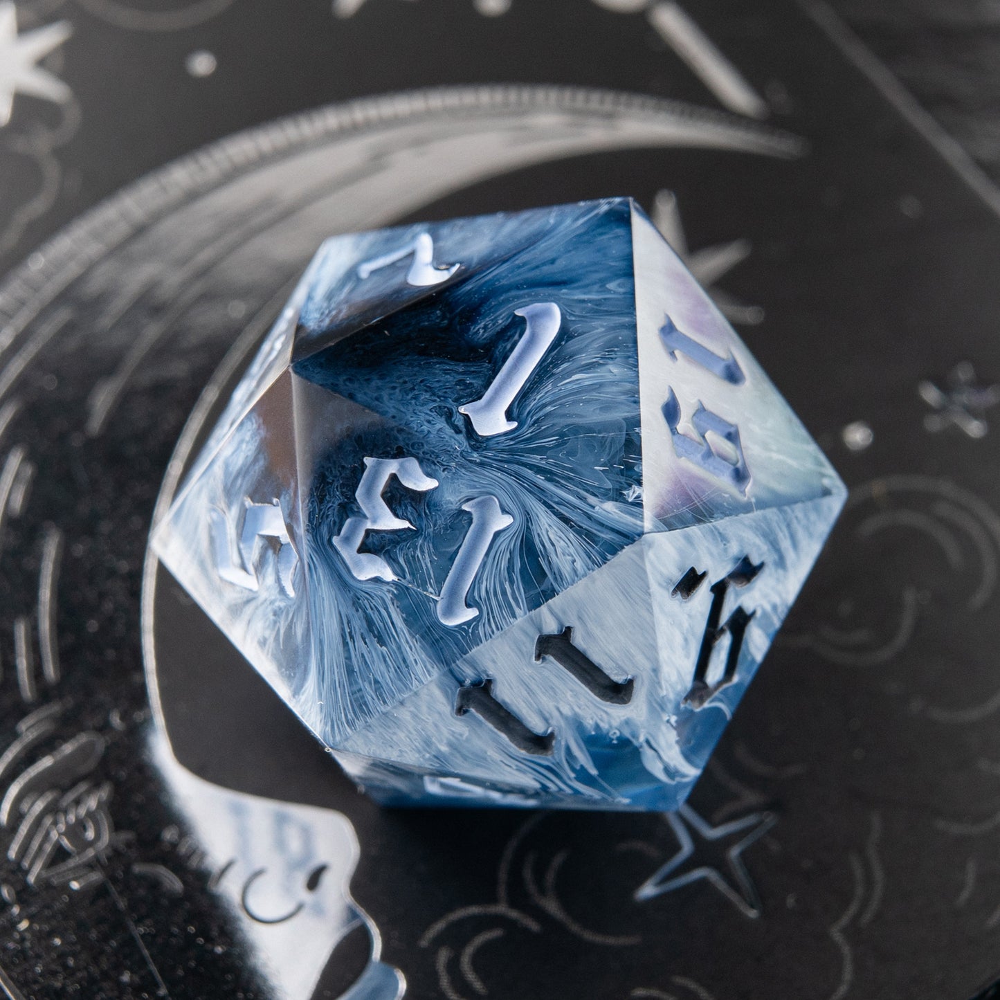 Frostbite artisan dice – cold marble effect resin D20 for tabletop RPG.