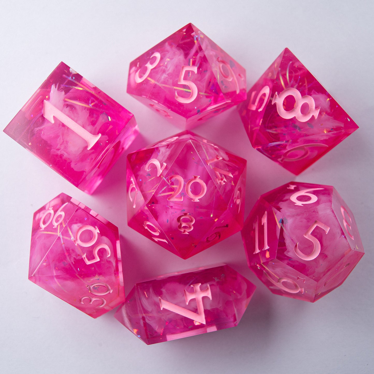 Close-up of Eternal Kiss D20 – artisan resin dice for tabletop RPG.
