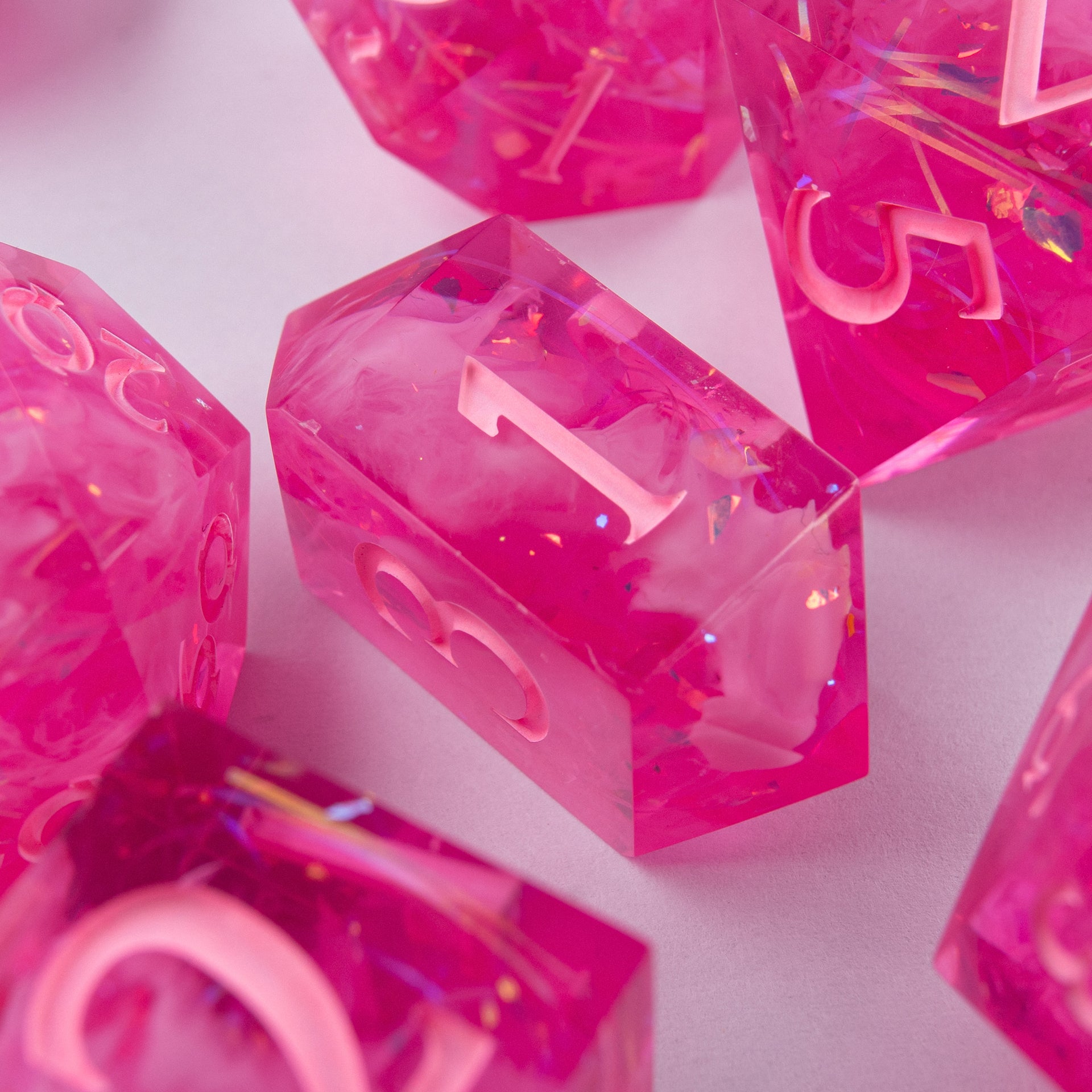 Eternal Kiss handmade resin dice – close-up of detailed engraving.