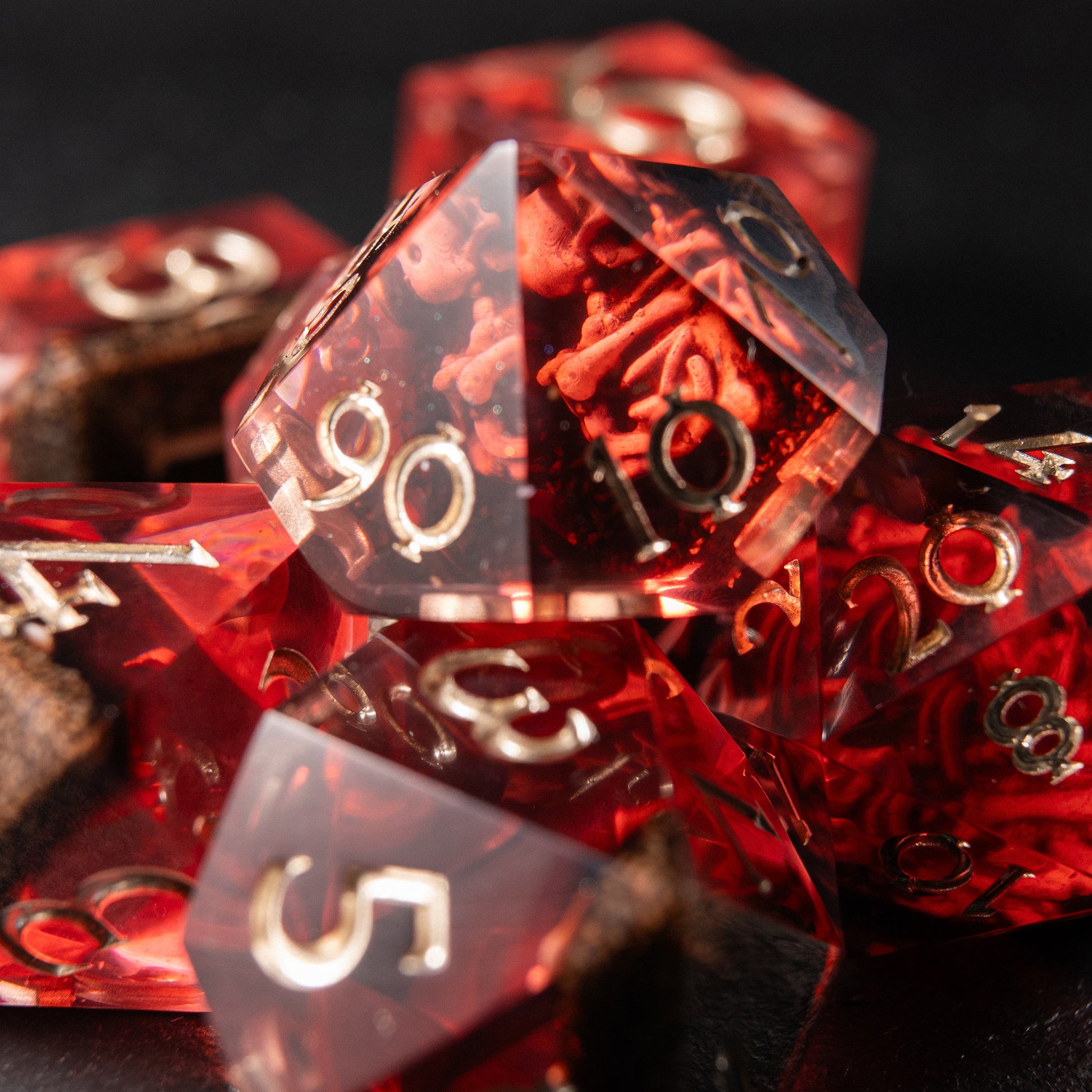 Crimson Reliquary resin dice – artisan red polyhedral set with bone relics for tabletop RPG