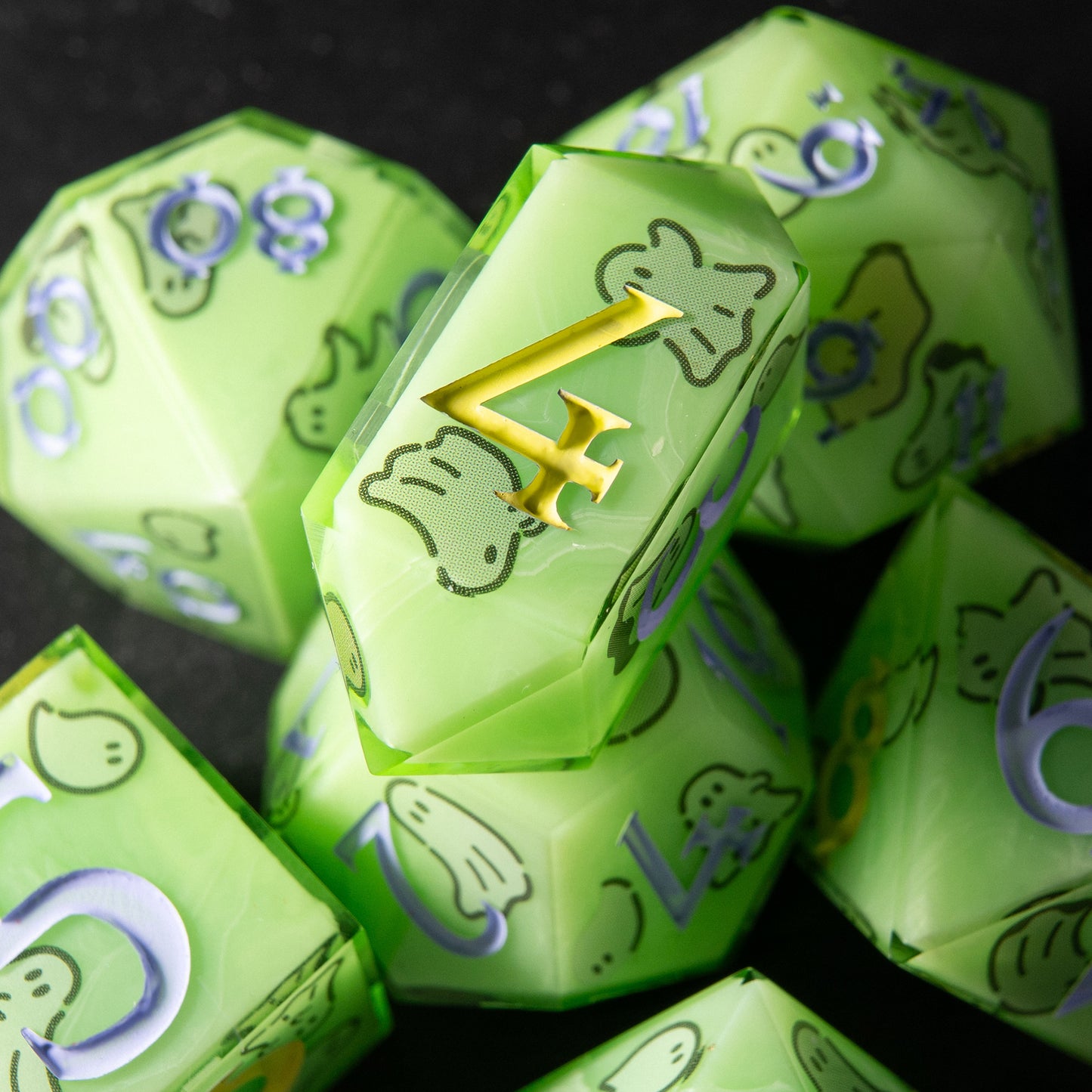Close-up Haunted Glow D20 – artisan green resin dice with spooky ghost illustrations.